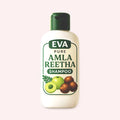 EVA Pure Amla Reetha Shampoo bottle on a light pink background